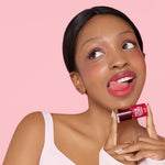 Long lasting fruit inspired lip stain combo on a plain backdrop.