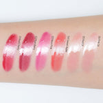 Swatch of the vibrant blue based cherry red shade on the skin.