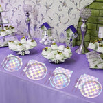 Top down view of iridescent checkered disposable party tableware