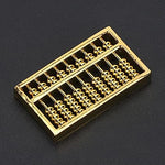 Detailed close-up of 9-gear brass abacus beads