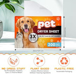 Oversized unscented pet hair dryer sheets being tossed into a laundry dryer drum