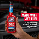Close up of STP Gas Treatment bottle instructions and product details