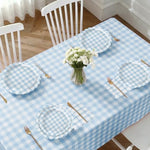 Light blue gingham tablecloth and party banner display