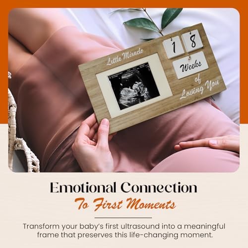 Close up of interchangeable wooden milestone tiles for baby tracking frame