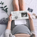 Eurset pregnancy countdown wooden frame placed on a nursery room display shelf