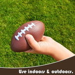 Toddler squeezing a mini sports stress ball to demonstrate material flexibility.