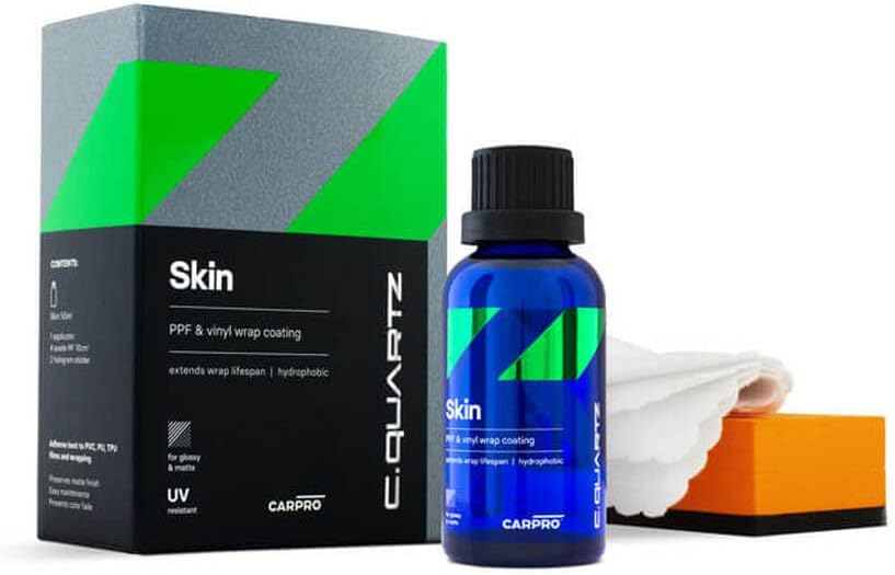 CarPro CQuartz Skin 50ml ceramic coating front view bottle on vehicle detailing workstation.