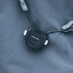 Side profile showing locking button and strap attachment