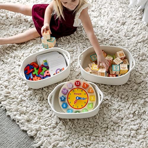 NaturalCozy small cotton basket used as a bathroom vanity organizer for towels and skincare products.