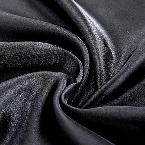 Top down view of black satin bedding on a mattress