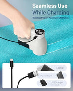 Handheld lint remover being used on a grey fabric sofa