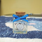 Top down view of Hamuiers baby boy hair keepsake bottle