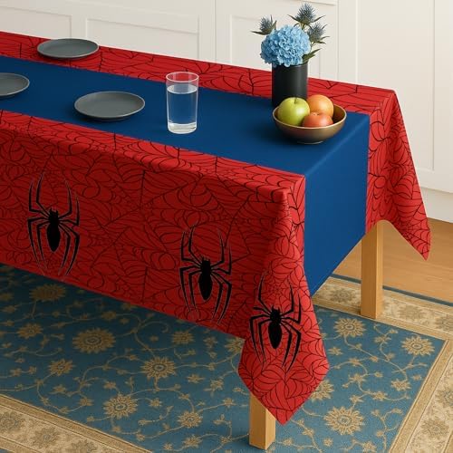 Close up of spider web print on blue and red plastic party tablecloth