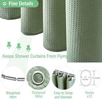 Full layout of the sage green weighted fabric shower curtain with twelve plastic hooks.
