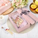 Compact decorative glass match jars styled as elegant reception table centerpieces.