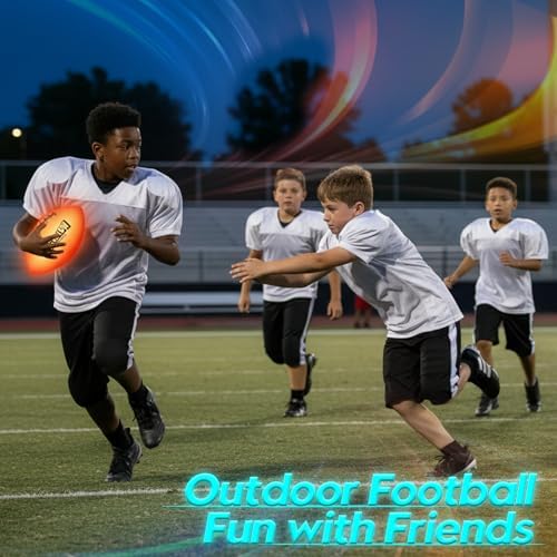 Waterproof Flashglow LED football on a grass lawn during evening family play