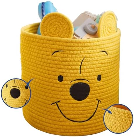 Idea Nuova Pooh Bear character rope bin standing upright on a playroom floor filled with kids books and toys