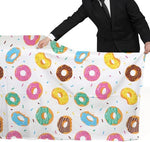 Side angle of Gatherfun donut themed baby shower table decorations setup