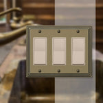 Amerelle cast metal wallplate tiered border close up detail