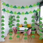 Pre-assembled felt clover banner draped neatly across a home fireplace mantel.