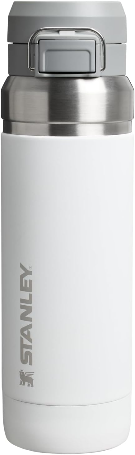 Authentic USA imported Stanley water bottle placed on a fitness mat.