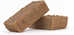 Close up shot of smooth and creamy artisanal fudge pieces illustrating the rich and dense texture.