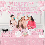 Close up of pink bow party paper cups and dessert plates