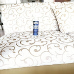 Applying Nanotech Surface Solutions liquid repellent to a luxury fabric sofa.