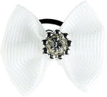 Detailed view of the sparkling diamante gemstone embellishment on the blue tournament bow.
