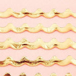 Top view of 50 pack disposable pink and gold foil napkins