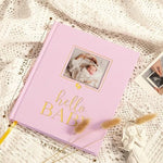 Open pages of the Lanpn five year keepsake journal displaying milestone tracking prompts.