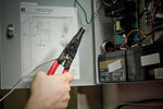 Milwaukee wire stripper in closed position with swing-lock mechanism
