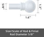 Close up of decorative ball finials on white curtain rod