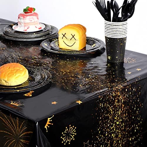 Top down view of black and gold 80th birthday table decoration