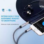 Tan QY audio cable connected to smartphone