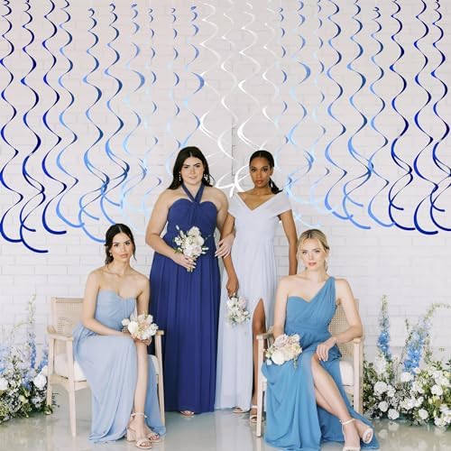 Pale blue and white spiral decorations dangling gracefully from a living room ceiling setup.