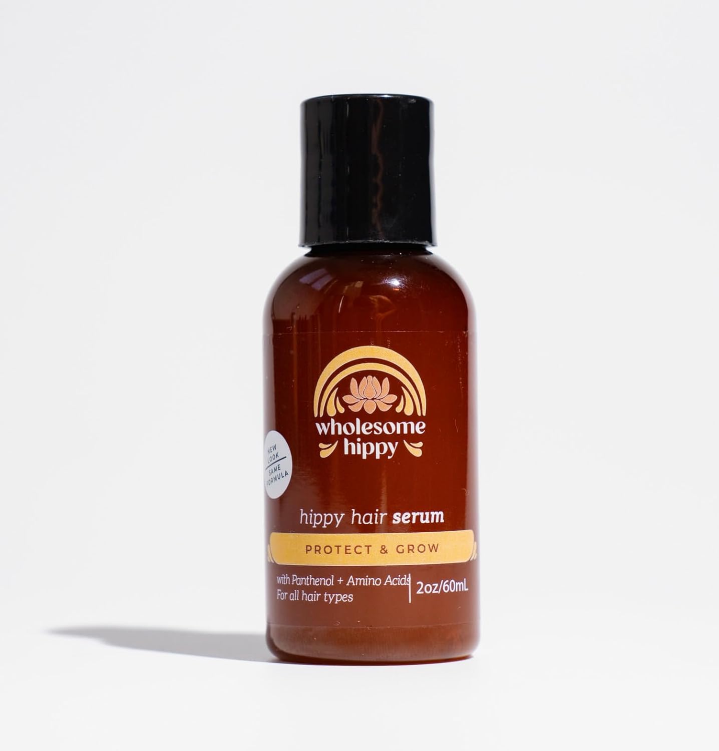 Wholesome Hippy Hippie Hair Elixir 2 Ounce front bottle view showing natural hair growth serum.