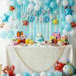 Sukh ocean theme party netting styled as a corner stuffed animal storage hammock