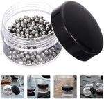 Hemoton stainless steel cleaning balls inside a glass wine decanter showing scrubbing action