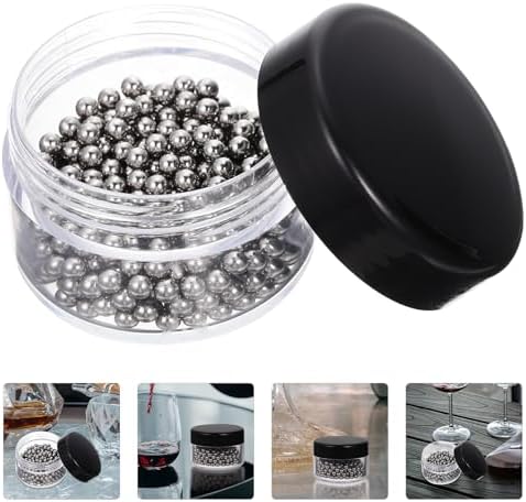 Hemoton stainless steel cleaning balls inside a glass wine decanter showing scrubbing action