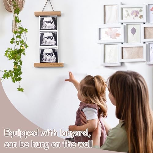 Zyeco sonogram picture frame mounted securely on a kitchen refrigerator door.