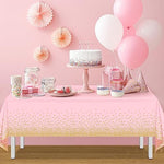 Top down view of FunnyPars pink and gold party table decor