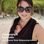 Mother utilizing the Vlokup quick dry sling for pool and beach babywearing.