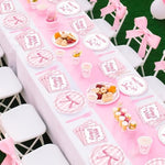 Top down view of full 120 piece pink bow tableware kit