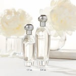 Side profile of Estee Lauder Pleasures perfume with silver cap
