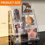 Wingsife multi-purpose clear display stand used for cosmetics and postcards on a desk.