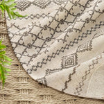 Beige neutral tone farmhouse style decorative curtain installed over a standard bathtub