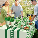 St. Patrick's Day party supplies including green tablecloth and cutlery