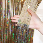 Shimmering metallic tinsel streamers close up material texture detail