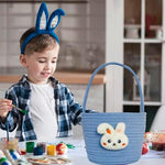 Close up shot of the white felt rabbit and carrot embroidery on the festive holiday bag
